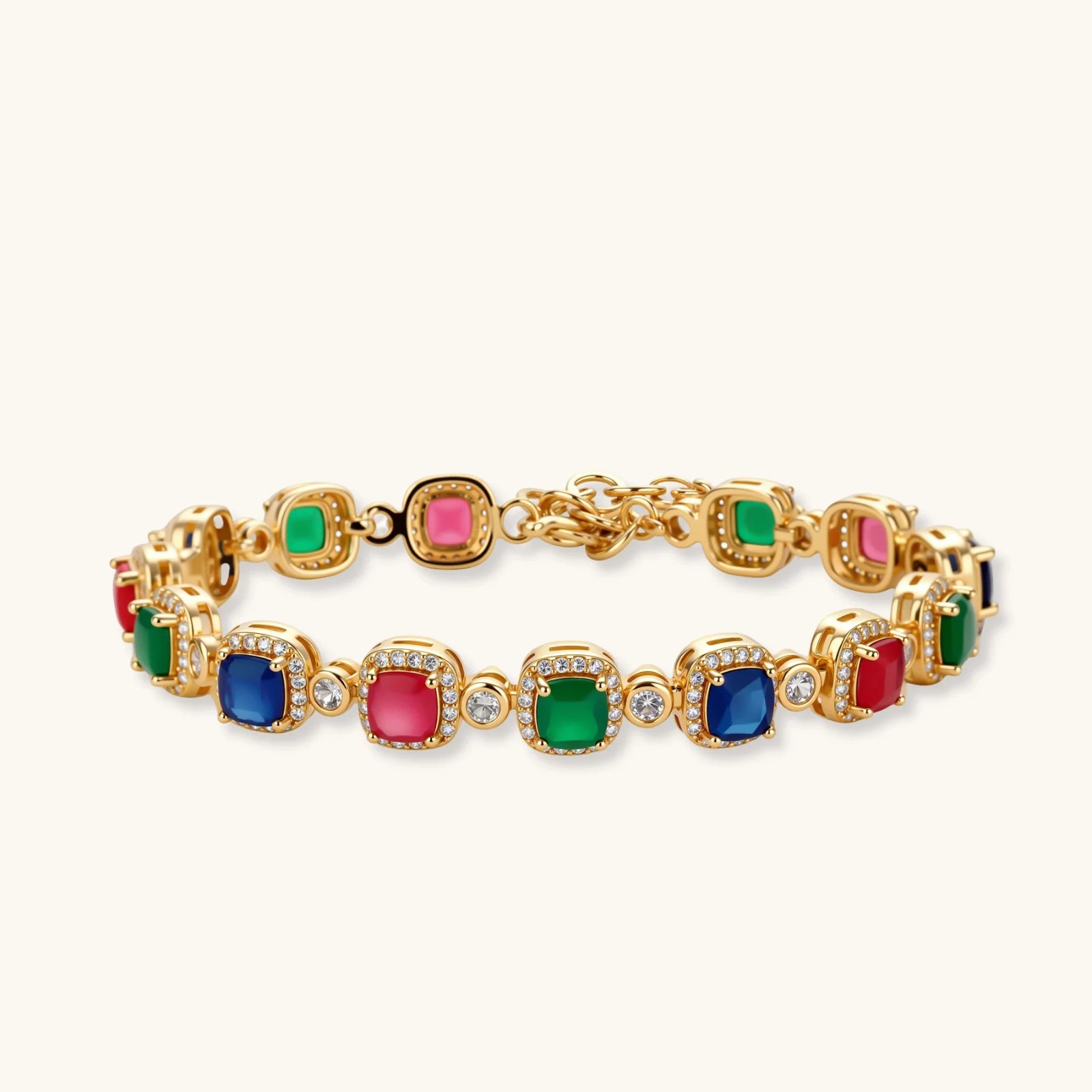 Gold-plated jewelry set with red, green, and blue cubic zirconia stones including necklace, bracelet, and drop earrings.