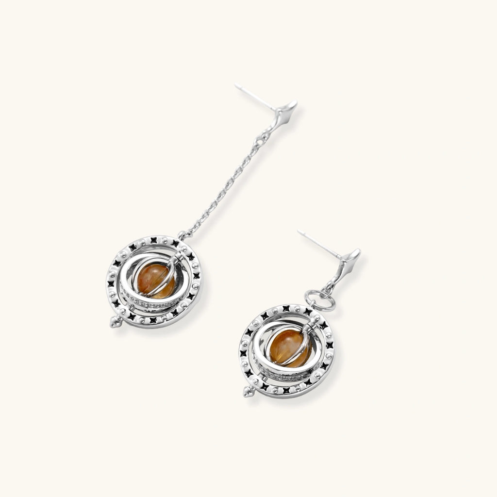 Complete jewelry set featuring citrine stone chips, silver beads, and cosmic circle pendants on cream background.