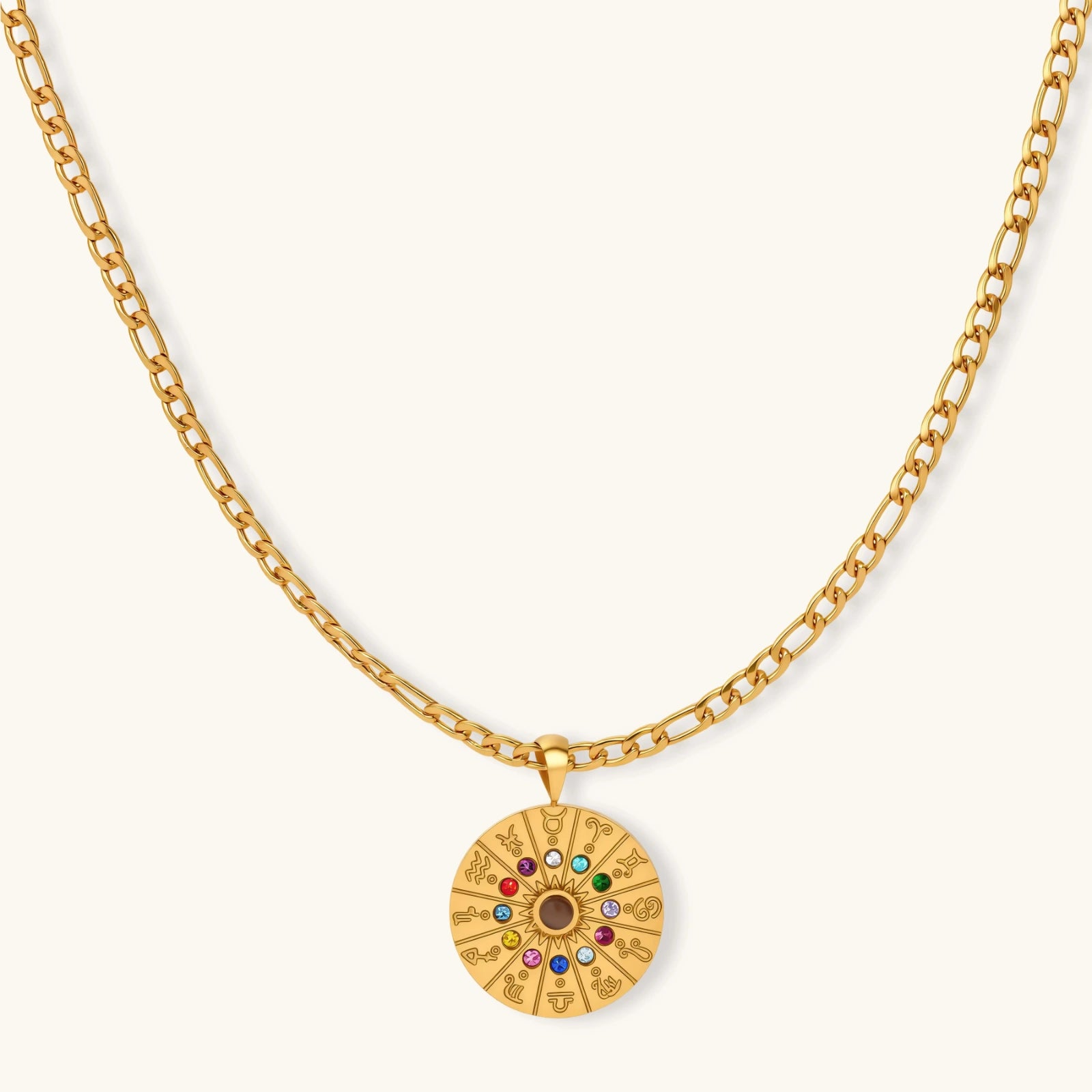 Gold-tone zodiac wheel pendant with 12 colorful cubic zirconia stones on a figaro chain, 18K gold plated stainless steel.