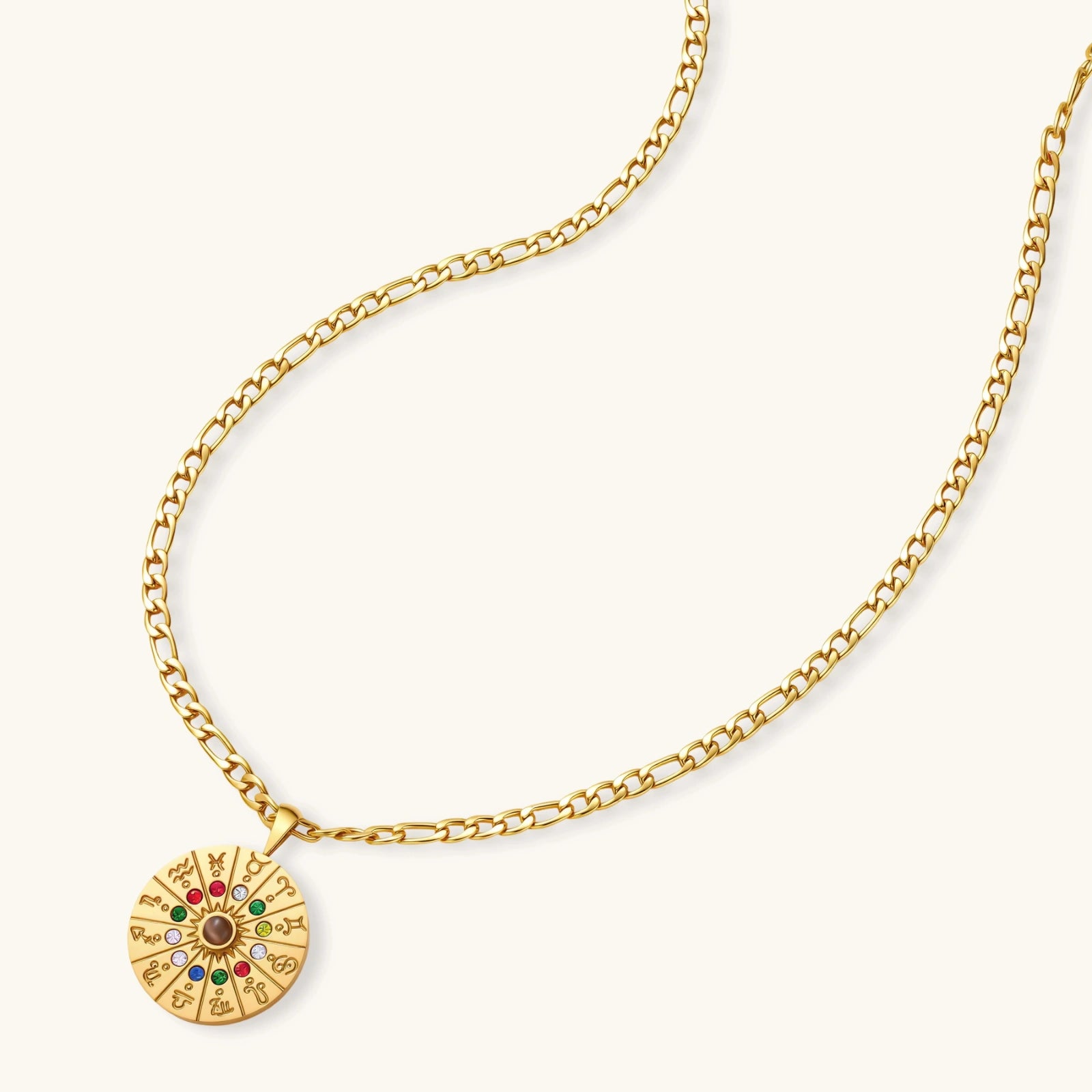 Gold-tone zodiac wheel pendant with 12 colorful cubic zirconia stones on a figaro chain, 18K gold plated stainless steel.